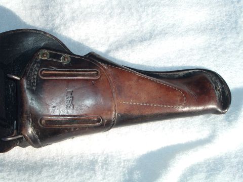 1995 Mercury Grand Marquis - A worn leather gun holster, marked with the "BOYT" brand, is displayed against a white background.