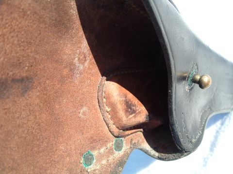 1995 Mercury Grand Marquis - Leather part with brass fastener and visible stitching detail.