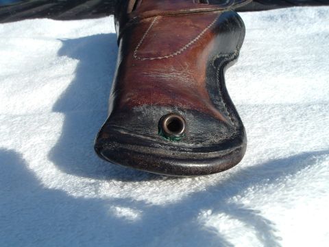 1995 Mercury Grand Marquis - Close-up of a leather holster with a metal grommet detail.