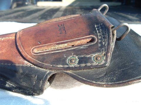 1995 Mercury Grand Marquis - A close-up view of a vintage leather holster with visible "BOYT" markings.