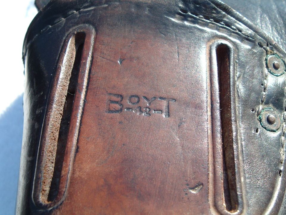 Leather holster with "BOYT" and "-12-" stamped