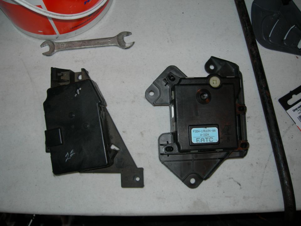 Ford EATC blend door actuator module F3DH-19E694-AA and bracket on workbench