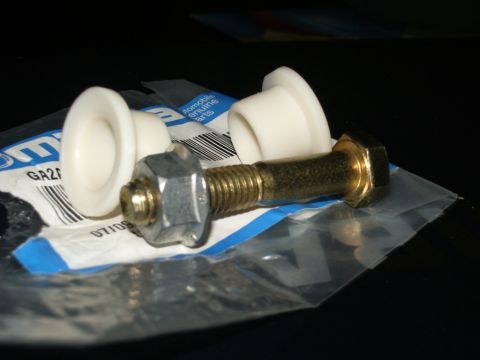 1995 Ford Probe - Close-up of shift linkage bushings and a bolt, with part number GA21 on the packaging.
