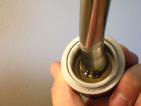 1995 Ford Probe - Close-up of a car part being held, with a website URL visible at the bottom right.