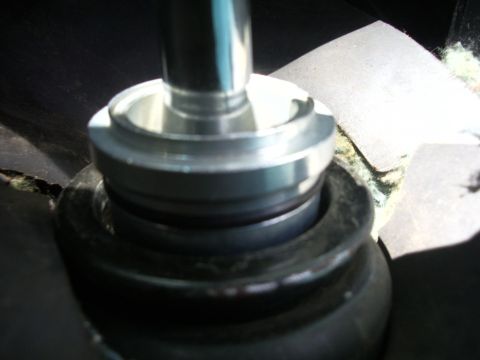 1995 Ford Probe - A close-up view of a short shifter mechanism, likely installed in the interior of a vehicle.