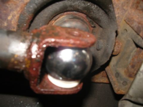 1995 Ford Probe - Close-up of a rusty ball joint, likely from a vehicle's suspension system.
