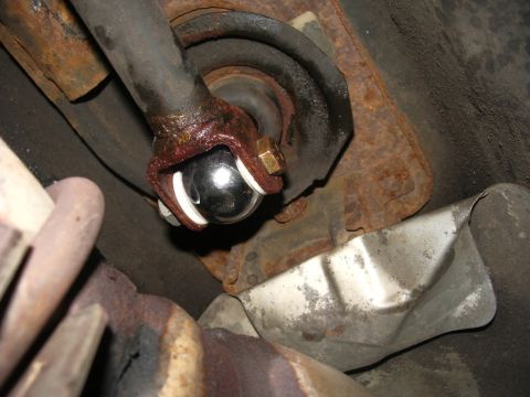 1995 Ford Probe - Close-up view of a shifter linkage's ball joint, likely part of a short shifter modification.