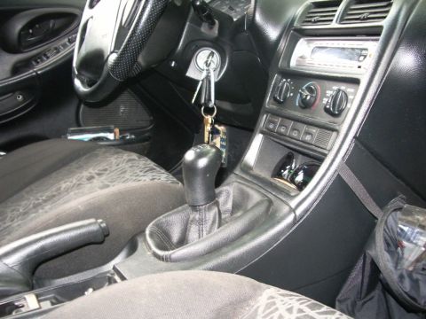 1995 Ford Probe - Interior view of a 1995 Ford Probe, highlighting the dashboard and center console.