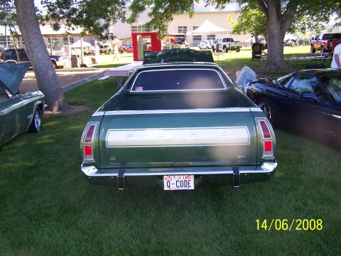 1972 Ford Ranchero - Green 1972 Ford Ranchero GT parked on grass at an outdoor event.