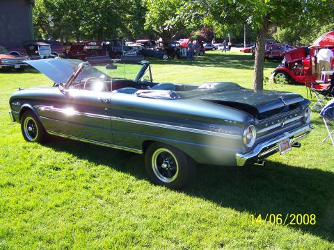 1972 Ford Ranchero - A 1963 Ford Falcon convertible is displayed at an outdoor car show.