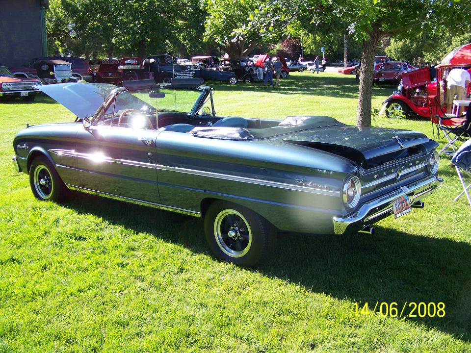 1963 Ford Falcon convertible parked on grass, hood open