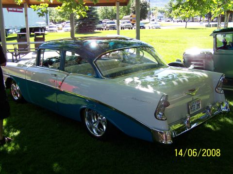 1972 Ford Ranchero - A classic two-tone Chevrolet sedan sits on display at an outdoor event.