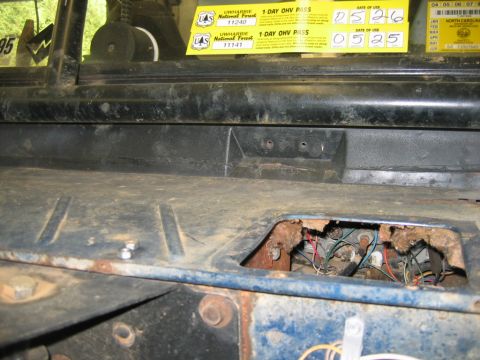 1992 Ford Mustang - Exposed wiring and rust are visible on the dashboard of this vehicle, which has US Forest Service OHV passes.