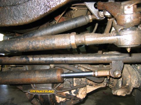 1992 Ford Mustang - Vehicle steering linkage and a Dynatrac shock absorber are visible in this close-up shot.