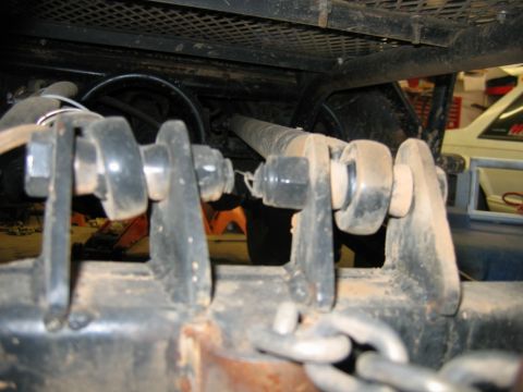 1992 Ford Mustang - Detail of a trailer hitch mechanism, showing the connection points and chains.