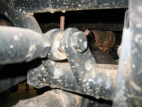 1992 Ford Mustang - Undercarriage view shows various mechanical components and suspension parts, heavily weathered and dirty.