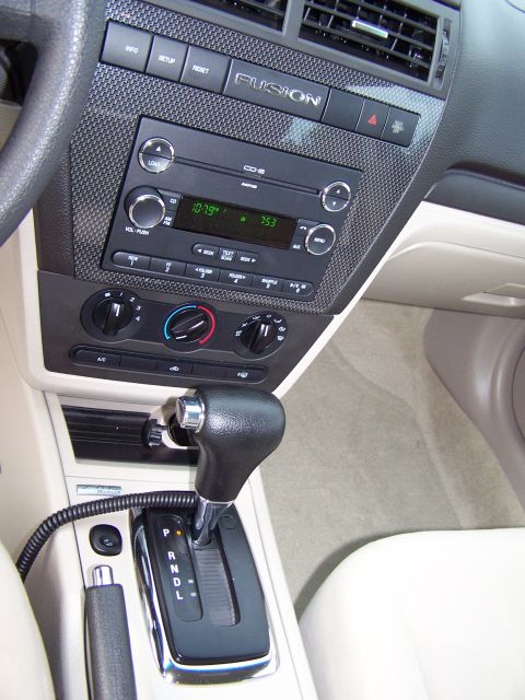 2008 Ford Fusion - The interior of a 2008 Ford Fusion, the dashboard, center console, and gear shifter.