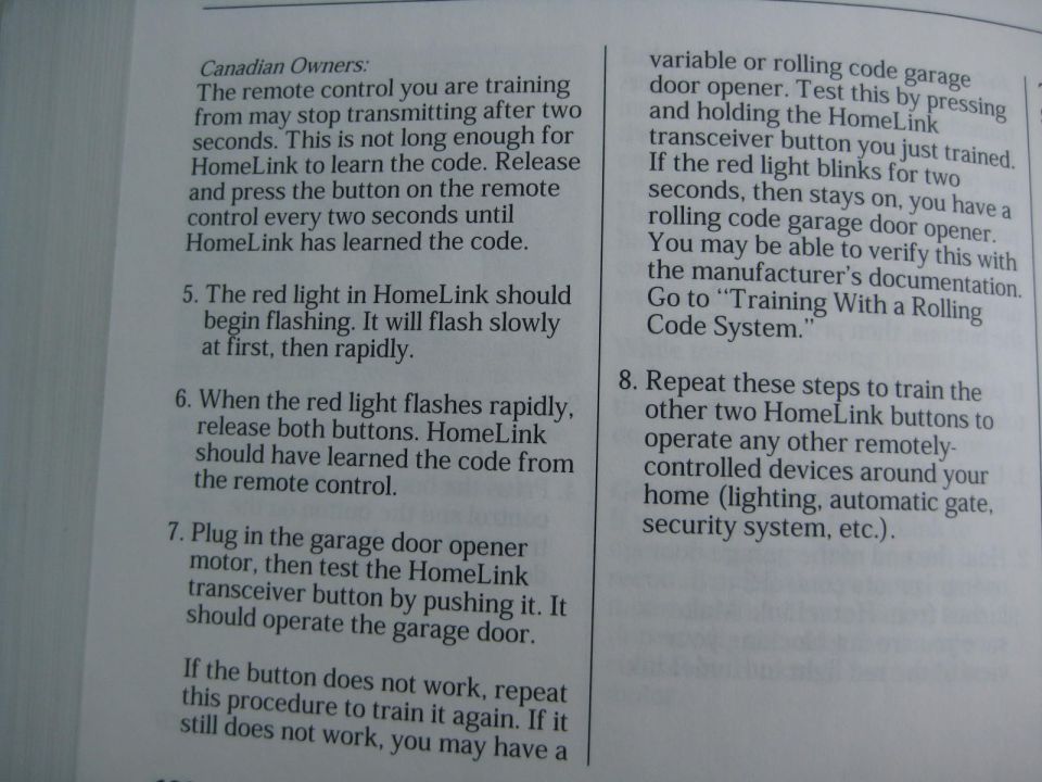 Owner's manual page with HomeLink transceiver training steps 5 through 8 for a garage door opener