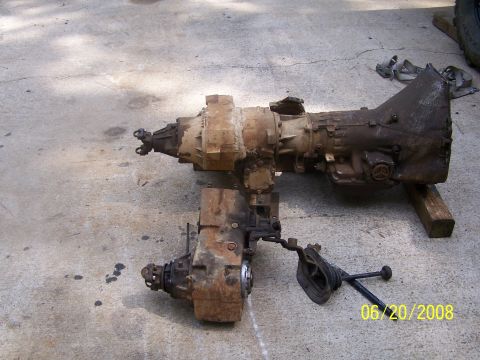 1979 Ford F-150 - This image shows a disassembled transmission and transfer case unit, likely removed from a vehicle for repair or replacement.