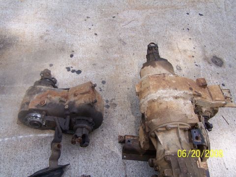 1979 Ford F-150 - Two heavily used transfer cases are shown on a concrete surface, with a date stamp visible on the right unit.