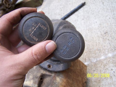 1979 Ford F-150 - Transfer case shift knobs with different gear selections labeled are shown.