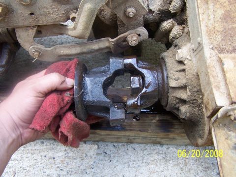1979 Ford F-150 - A hand cleans a driveshaft universal joint. The image contains a date stamp of 06/20/2008.