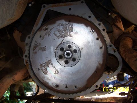 1979 Ford F-150 - Close-up view of a vehicle's flywheel and transmission bell housing, with a date stamp visible in the lower right corner.