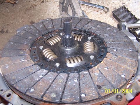 1979 Ford F-150 - A clutch disc assembly is shown, springs and worn friction material, with a visible date stamp.
