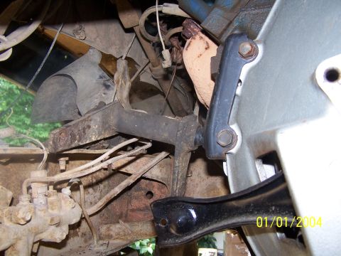 1979 Ford F-150 - A close-up view of engine bay components, including hoses and brackets, with a visible date stamp of 01/01/2004.