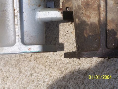 1979 Ford F-150 - Close-up of two metal components, one clean and one heavily corroded, with a visible date stamp.