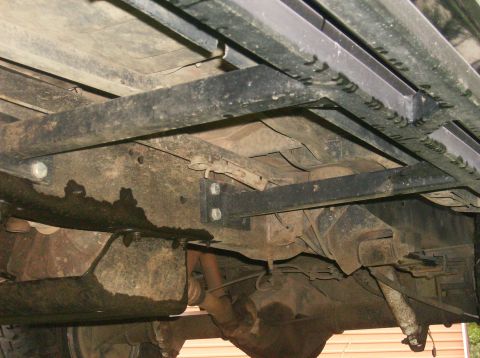 1990 Ford Bronco - This photo shows the undercarriage of a vehicle, highlighting the sliders that have been mounted.