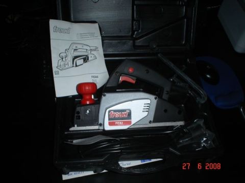 1990 Ford Bronco - A Freud FE82 electric planer is shown inside its black carrying case, along with its instruction manual and accessories. A date stamp in th…