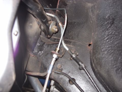 1978 Ford Mustang II - Undercarriage view of brake lines and suspension parts, with no visible year identification.