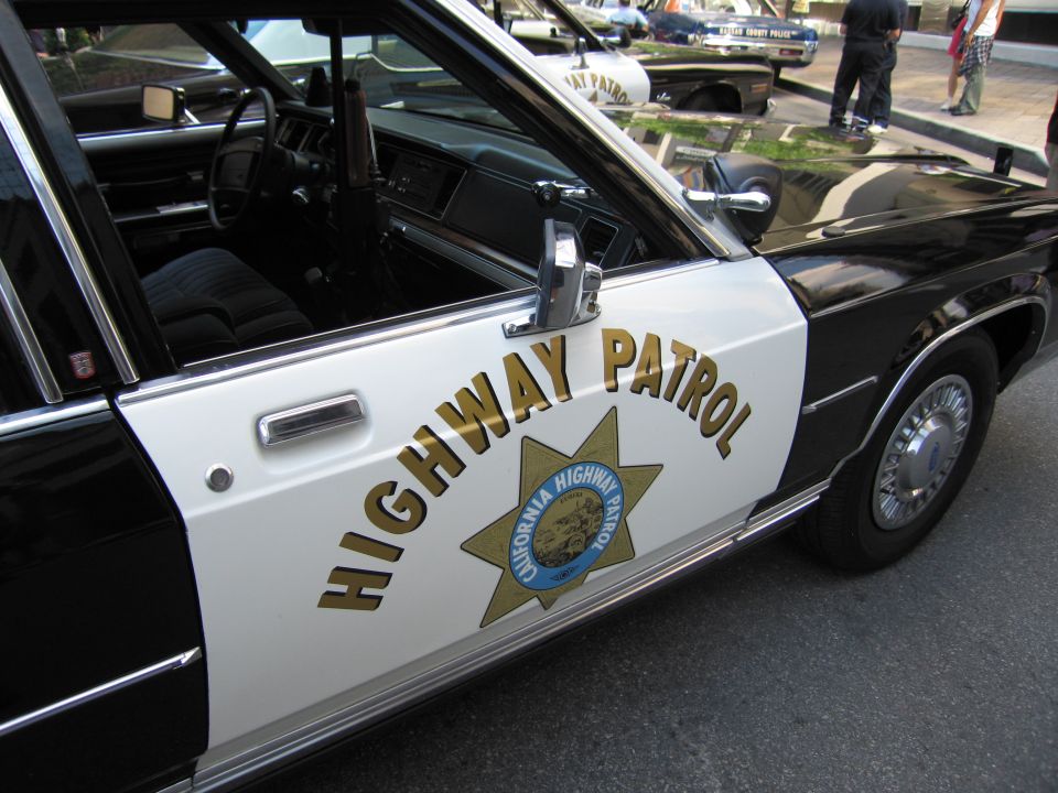Black-and-white California Highway Patrol car door with CHP star emblem