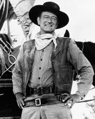 1991 Ford Crown Victoria - A black and white photo shows a man dressed as a cowboy, with a website watermark at the bottom.