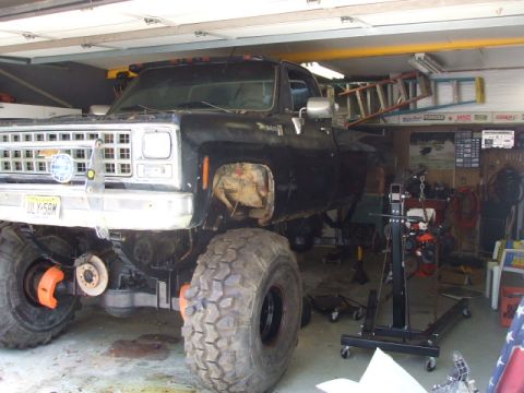 1987 Suzuki Samurai - The rear of a 1987 Suzuki Samurai is shown, its spare tire and bumper.