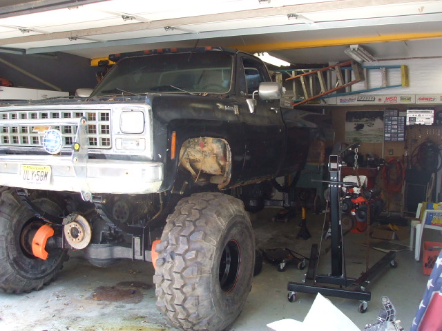 1987 Suzuki Samurai rear view, white exterior, visible spare tire and bumper