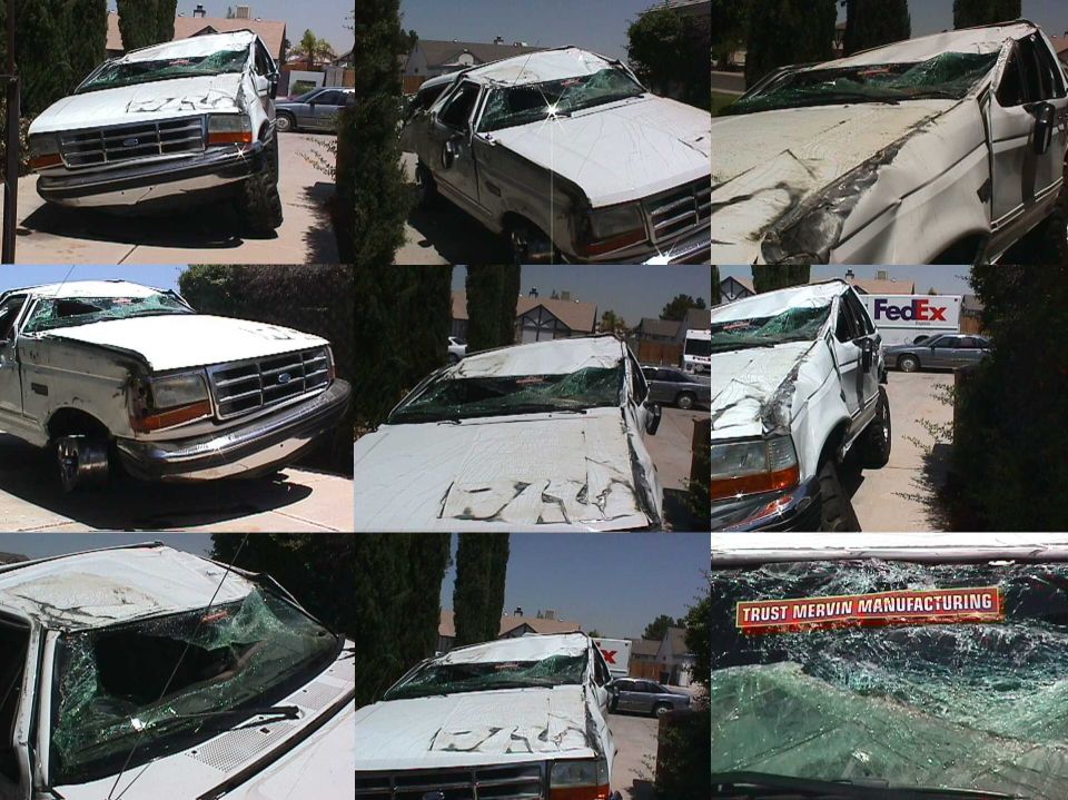 White Ford F-Series truck with a damaged front end and cracked windshield