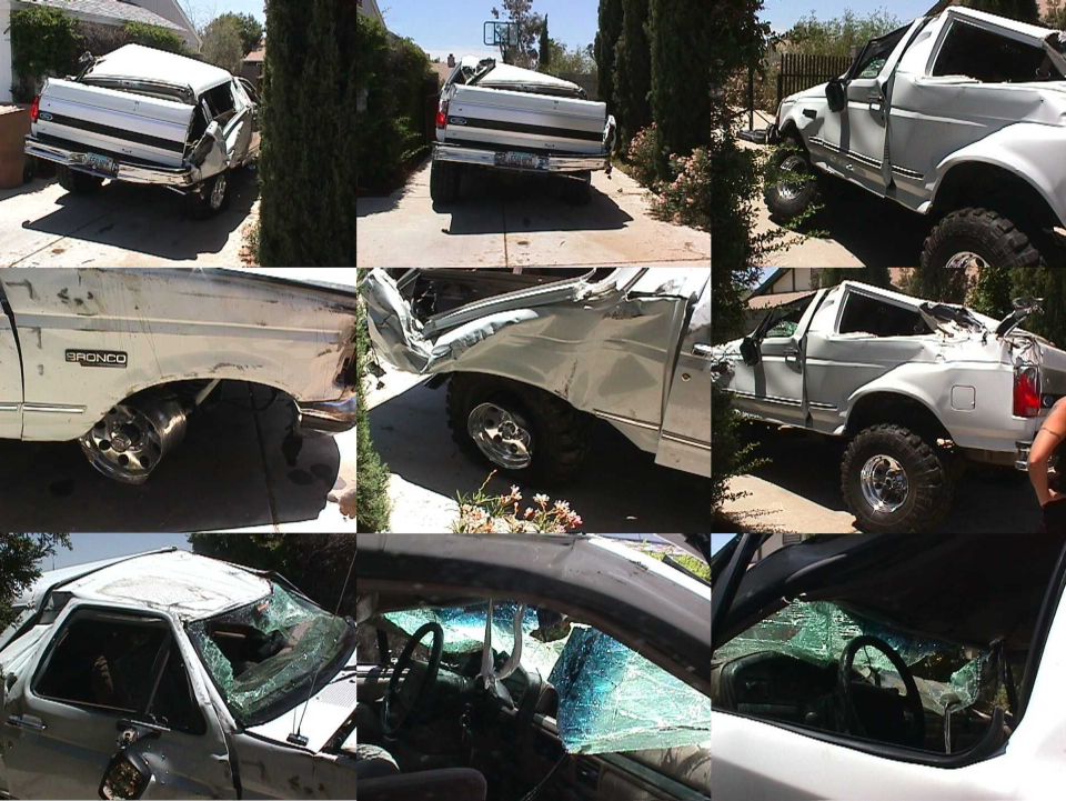 White 1994 Ford Bronco with significant damage, showing side and interior views