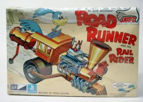 1991 Ford Bronco - The image shows the box art for a plastic model kit of the Road Runner and his Rail Rider, a cartoon vehicle from Looney Tunes. The box fea…