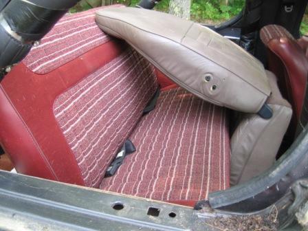 1993 Ford Bronco - Rear seat, seating surface has no tears, one or two small rips in front vertical section of bottome cushion. Ignore junk Tan leather seat b…