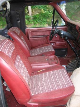 1993 Ford Bronco - Front seats - passenger side has rip.