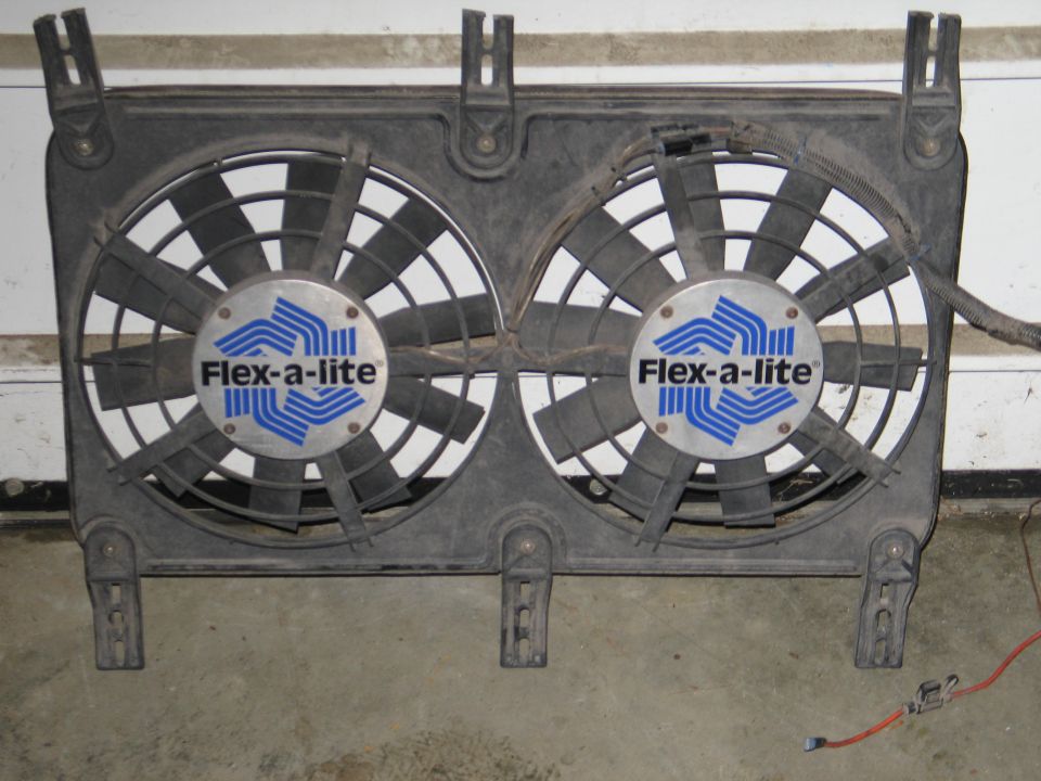 Dual Flex-a-lite electric fans in a black shroud.
