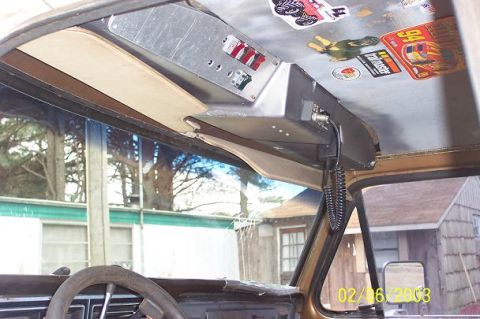 1979 Ford Bronco — Overhead console with switches and stickers in a vehicle interior