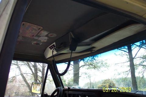 1979 Ford Bronco interior showing overhead console with CB radio and coiled cord