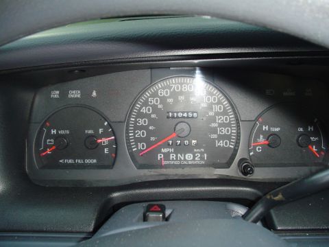 2000 Ford Crown Victoria - The instrument cluster displays mileage, speed, fuel, and temperature readings.