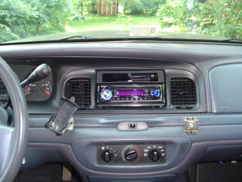 2000 Ford Crown Victoria - Interior view of a 2000 Ford Crown Victoria, highlighting the dashboard and an aftermarket stereo system.