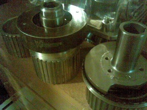 1972 Ford Ranchero - Two metal automotive components, possibly gears or pulleys, are shown in a close-up view.
