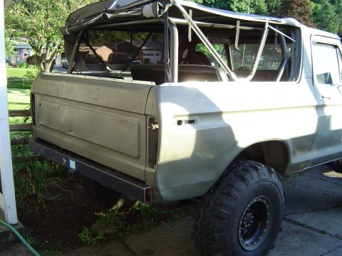 1978 Ford Bronco - Rear view of a 1978 Ford Bronco with a custom bumper and off-road tires.