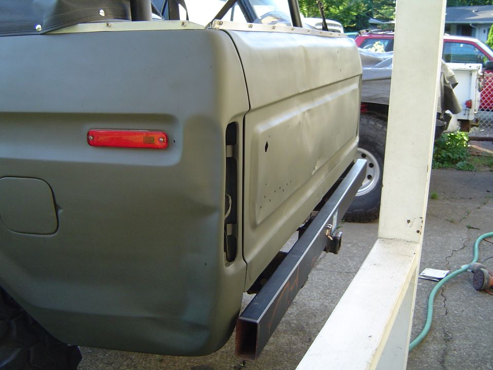 Green 1978 Ford Bronco rear quarter panel with aftermarket bumper